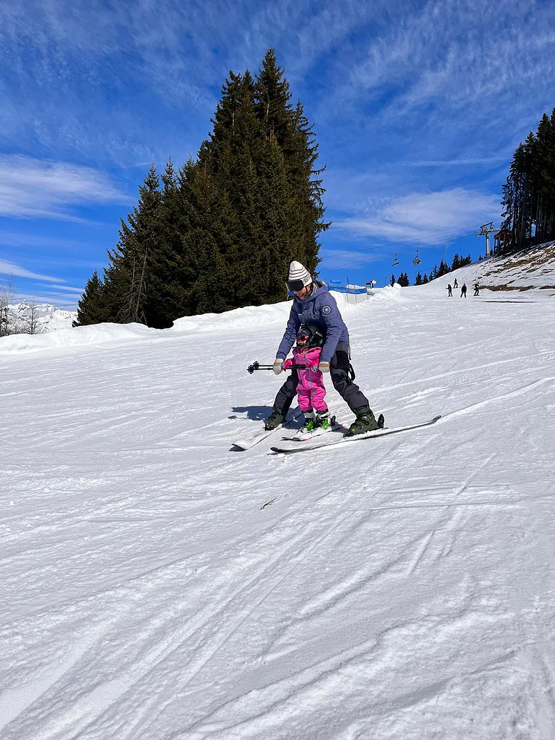 Skiing side by side with a little girl
