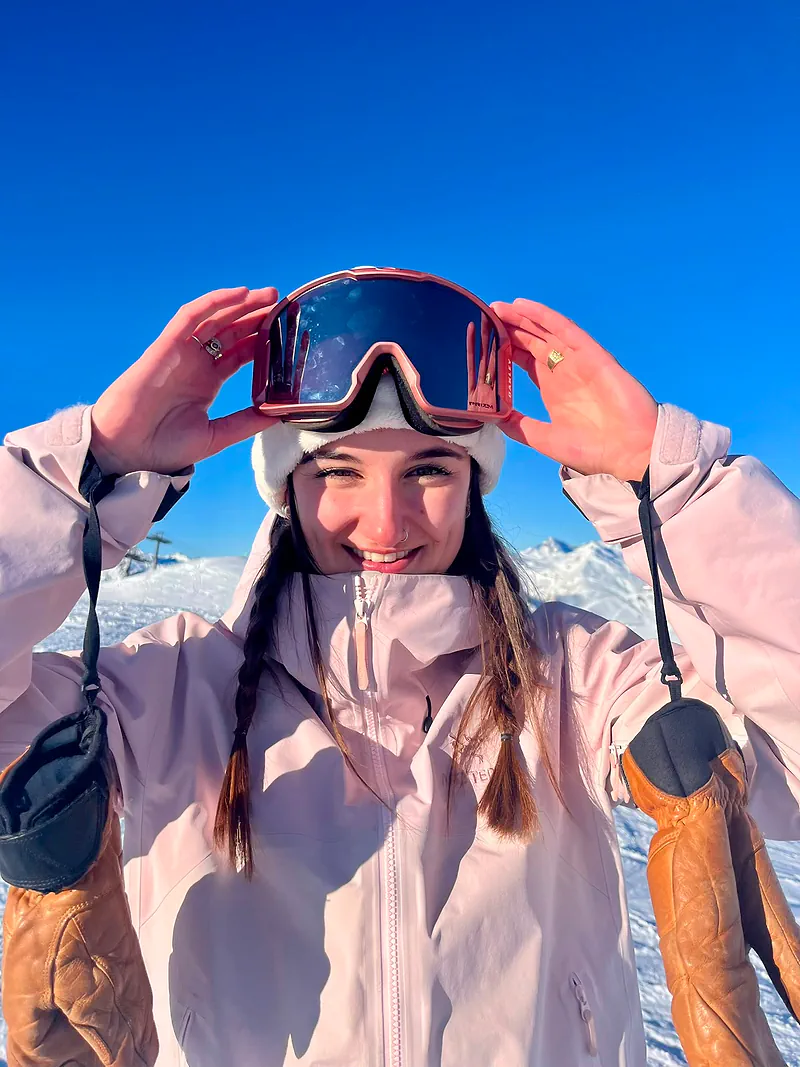 Valentina on the slope, goggles raised